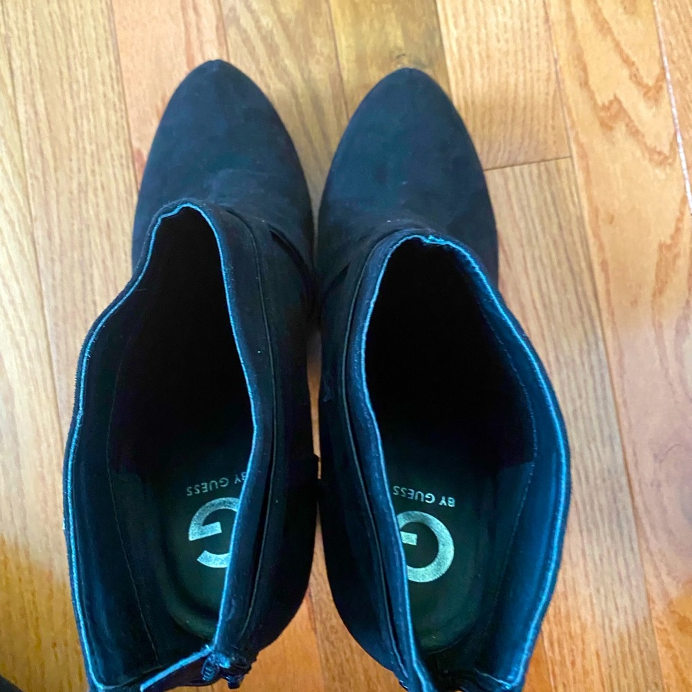 Black Suede booties by Guess. Size 9.5M. Has a zipper in the back.
